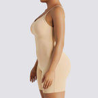 Celviroa black seamless flat belly shapewear bodysuit with medium compression and spaghetti straps, made of stretchable polyester.