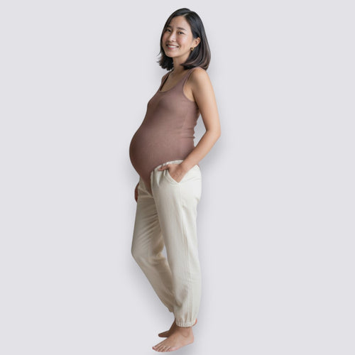 Celviroa full body sculpt shaper in brown, made of nylon and spandex, worn by a pregnant woman.