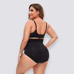 Plus size black high-waist shapewear shorts made of nylon with medium stretch for tummy control and a smooth silhouette.