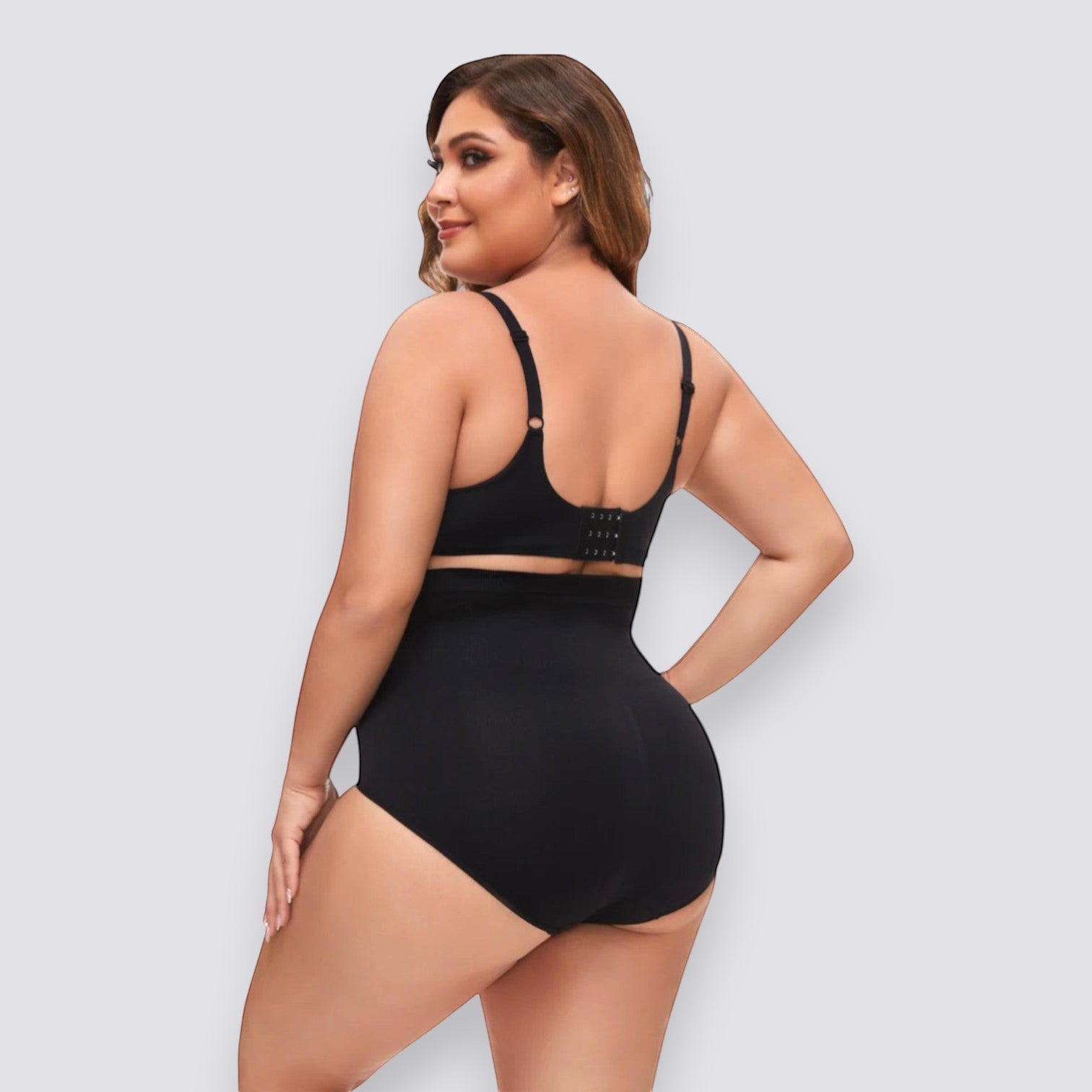 Plus size black high-waist shapewear shorts made of nylon with medium stretch for tummy control and a smooth silhouette.