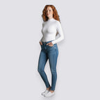Celviroa white long-sleeve zip-front bodysuit made of polyester and spandex blend, worn by a model with red hair.